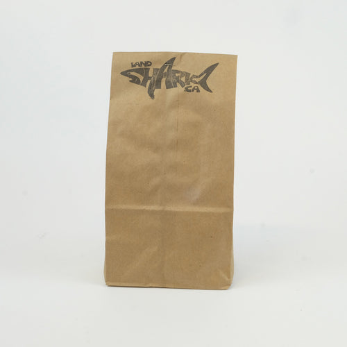 Brown paper bag with the Landsharkz.ca logo stamped on the top.