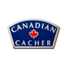 Canadian Cacher pin with a blue background and silver writing with a red maple leaf in the centre