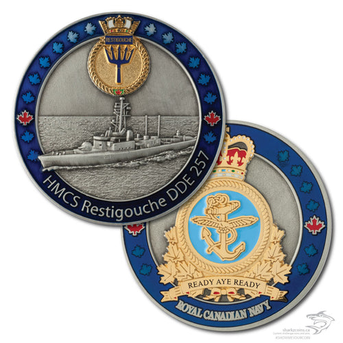 Both sides of the HMCS Restigouche.  The first is a 3D antique silver picture of the ship with a blue border and the ships crest at the top in polished gold.  The opposide side is the Royal Canadian Navy crest in polished gold with an antique silver background and the same blue border.