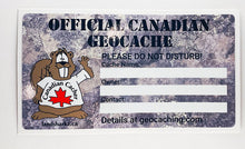 One geocaching sticker in stone granite.  beaver dude's image is on the left and the areas to write the cache name, owner and contact details is on the right. The top says in stencil font: Official Canadian Geocache