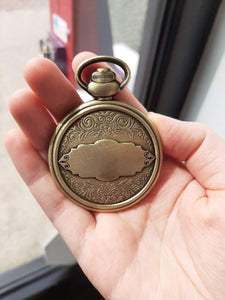 The Back of the Retirement Pocket Watch coin in someone's hand