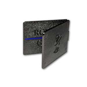 RCMP wallet coin standing open showing the back with the boots and Stetson. 