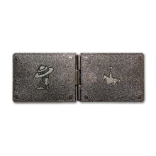 RCMP wallet coin open flat from the back showing the horse and rider and the boots and hat  that appear to be embossed into the leather. 