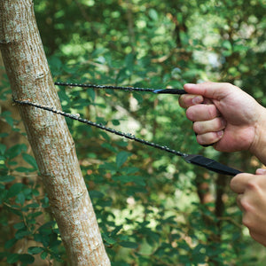 saw being used on small tree branch