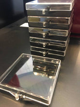 Stack of acrylic coin cases