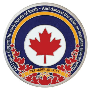 One side of the Royal Canadian Air Force coin pictured.  It is antique silver with blue and yellow borders around a red maple leaf on a white background. 