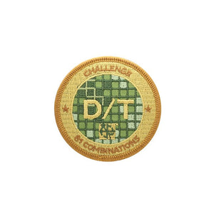 Patch with a gold background and green centre, with D/T over top of the green grid pattern.  It says Challenge, 81 Combinations around the edge.