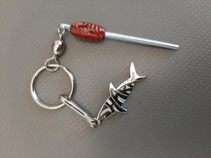 Silver Sharkz logo on a keychain with a nano log roller with a red bead