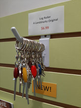 Multiple nano log rollers with various coloured beads displayed in our store.  The sign behind them says $6.99 each