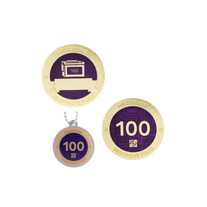 Milestone geocoin in gold with purple paint for your 100th find.  Front and back pictured, as well as the matching tag.