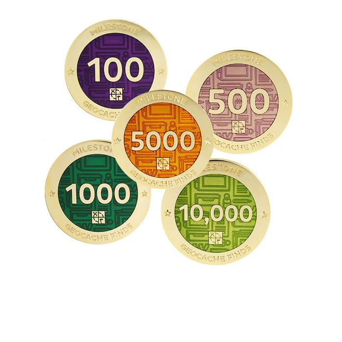 Images of 5 milestone geocoins for 100, 500, 1000, 5000 and 10000 in multiple colours