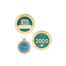 Milestone geocoin in gold with turquoise paint for your 2000th find.  Front and back pictured, as well as the matching tag.
