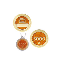 Milestone geocoin in gold with orange paint for your 5000th find.  Front and back pictured, as well as the matching tag.