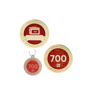 Milestone geocoin in gold with dark red paint for your 700th find.  Front and back pictured, as well as the matching tag.