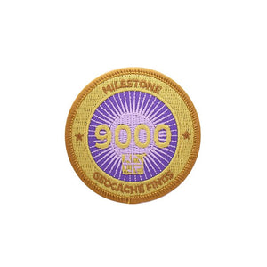 Gold patch with a purple background for 9000 finds