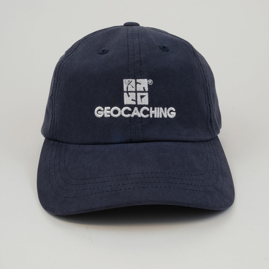 Navy blue baseball hat with a white geocaching.com logo.