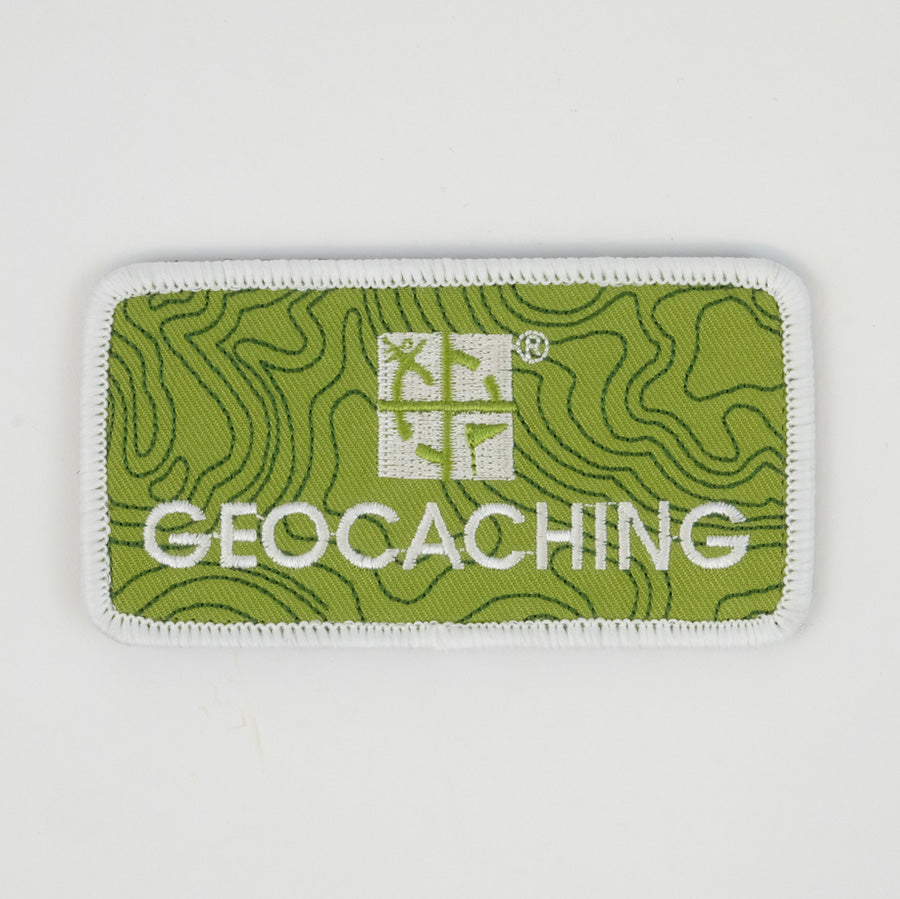 Green rectangle patch with a white border.  It has the geocaching.com logo and says Geocaching under it.