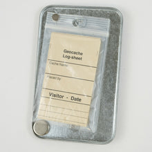 Inside of Magnetic Outlet Cover Geocache with log sheets and magnet