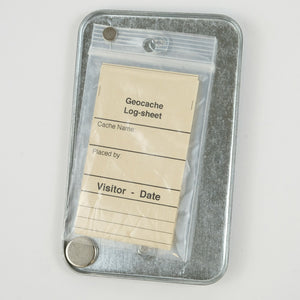 Inside of Magnetic Outlet Cover Geocache with log sheets and magnet