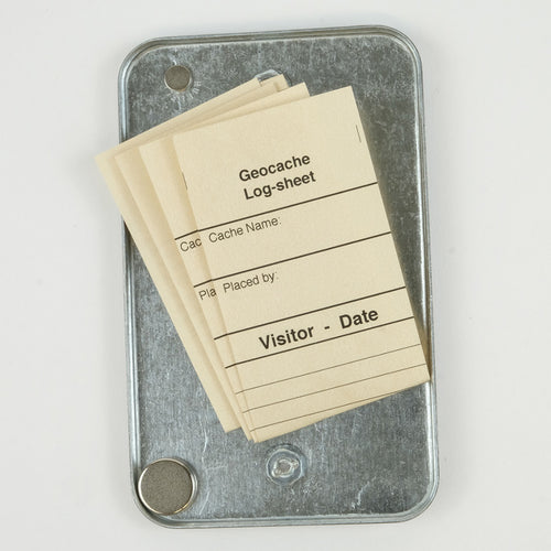 Outlet cover geocache with magnet and log sheets