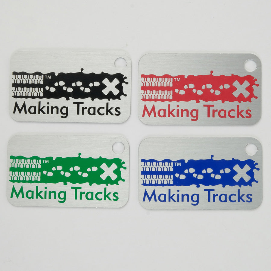 4 Making Tracks tags in black, pink, green and blue