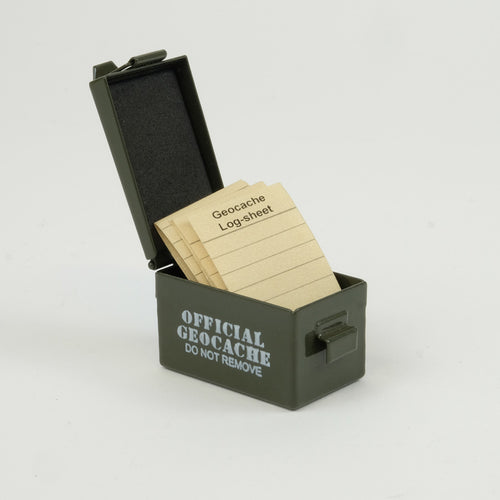 Green micro ammo can cache, open with log sheets in it