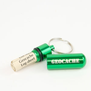 Green micro cache with logsheets rolled up inside them