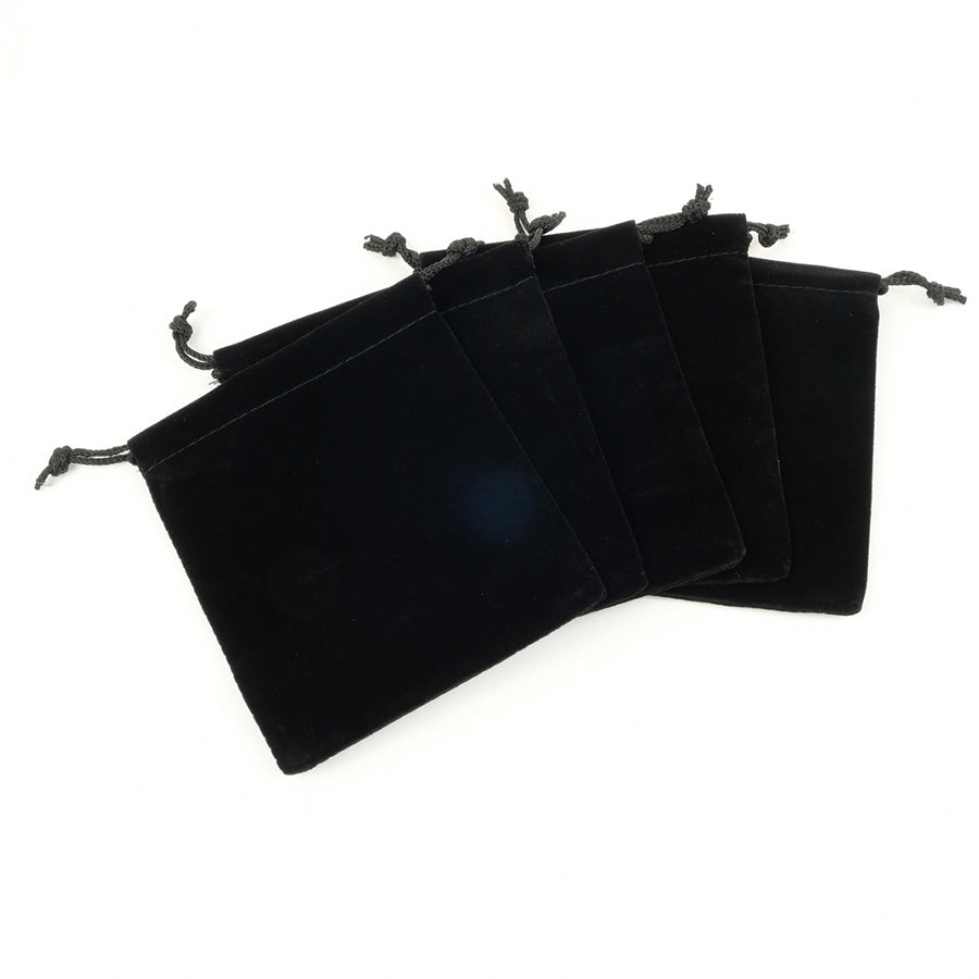 Five black velvet draw string bags fanned out 