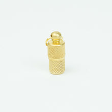Close up of brass nano cache
