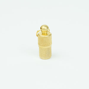 Close up of brass nano cache