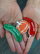 Three proxy tags in hands to show size